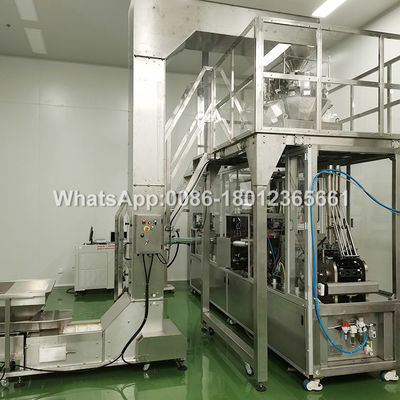 Machine de remplissage et de scellage de capsules de café à deux voies